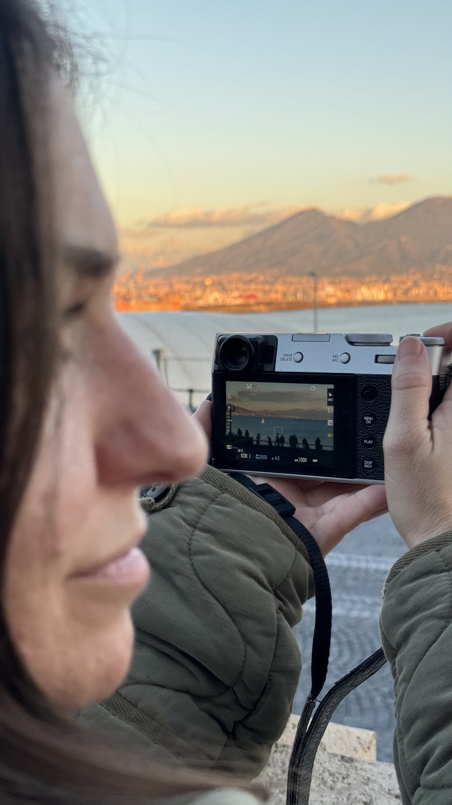 Audrey photographing the sunset with her Fujifilm camera